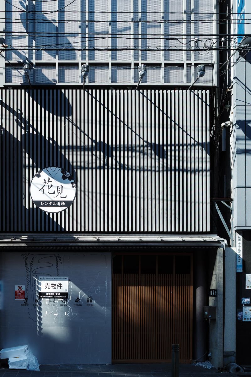 Traditional wooden lattice storefront in a historic Japanese teahouse district
