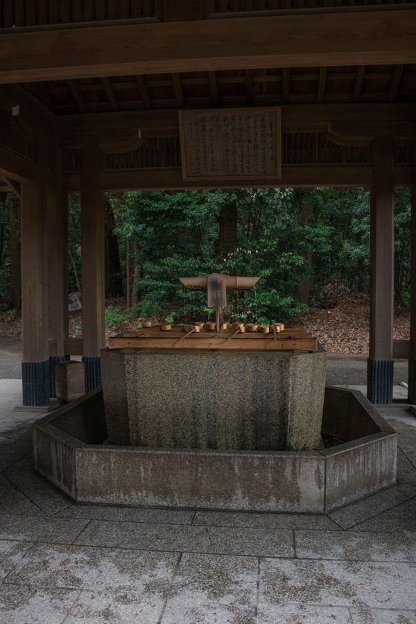 A traditional stone well at a Japanese shrine, similar in style to Okiku's Well at Himeji Castle