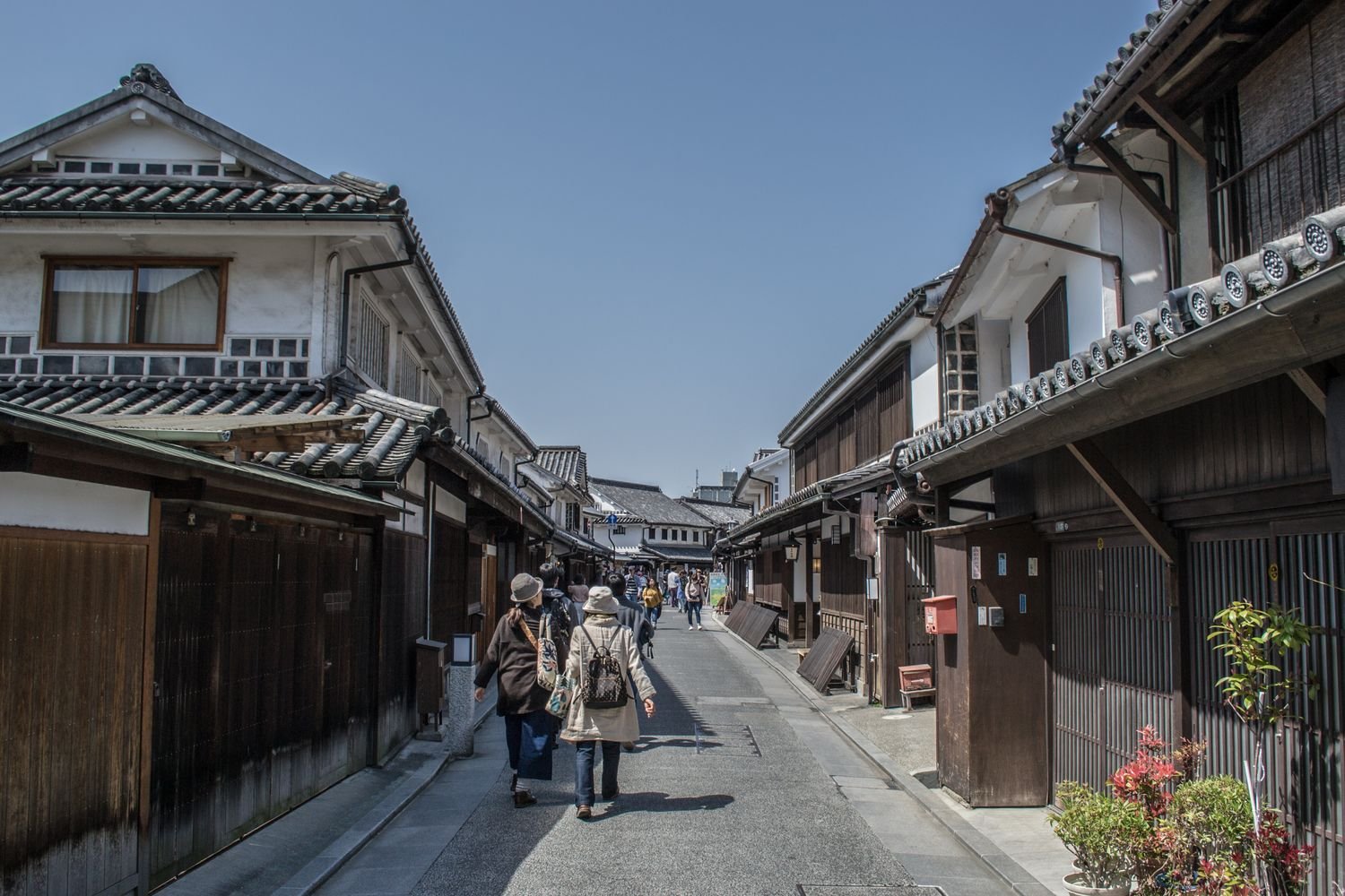 Traditional narrow street in a historic Japanese town with old wooden houses