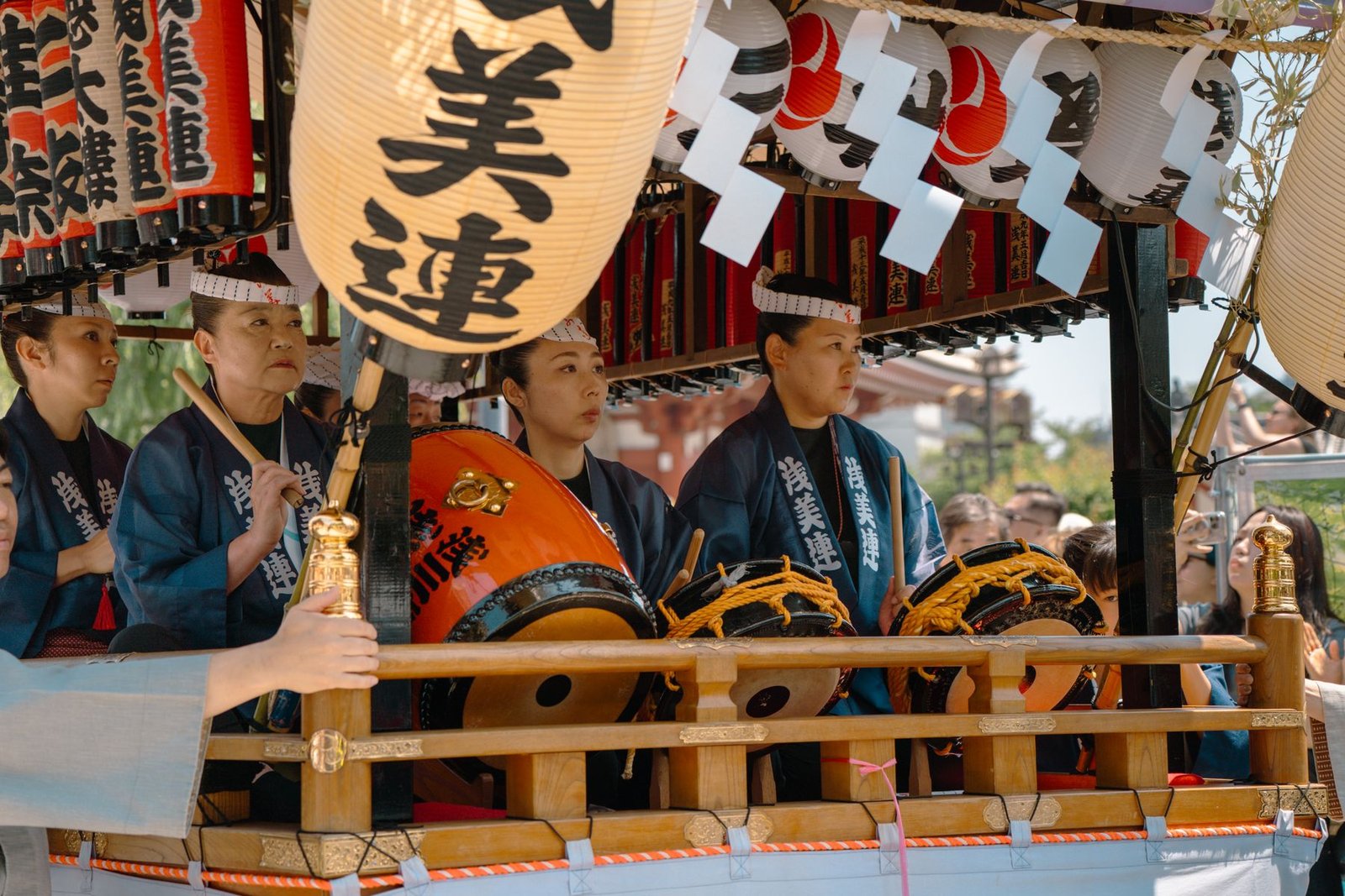 A vibrant scene of taiko drummers at a traditional Japanese festival