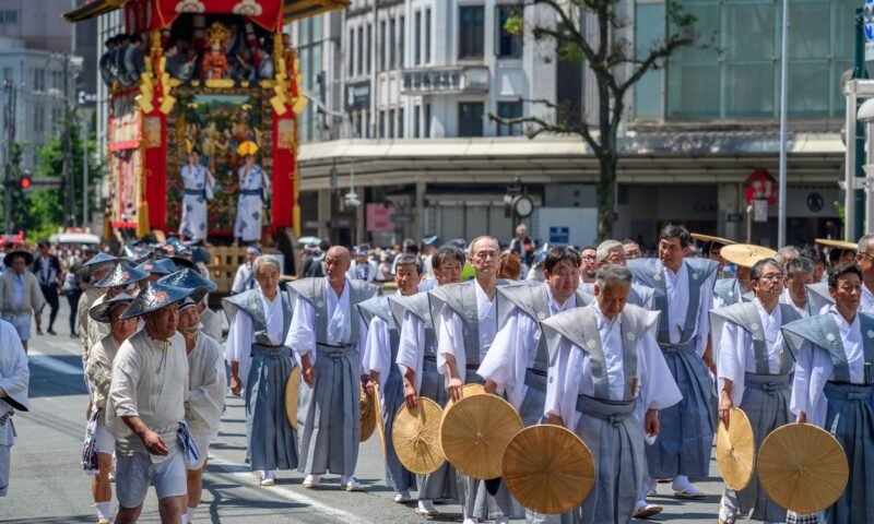 Traditional costumed parade marching through Kyoto streets during a historical festival