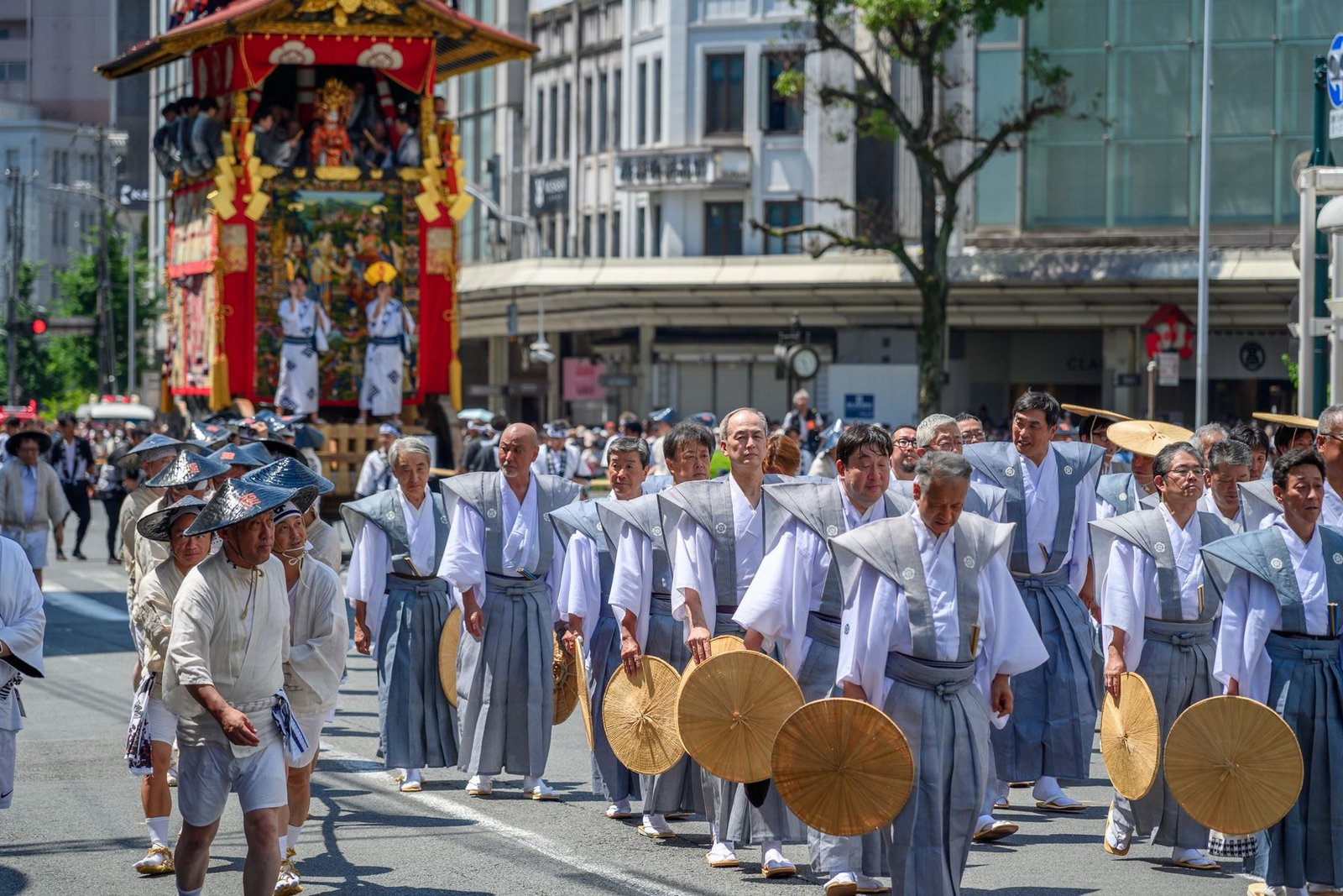 Traditional costumed parade marching through Kyoto streets during a historical festival