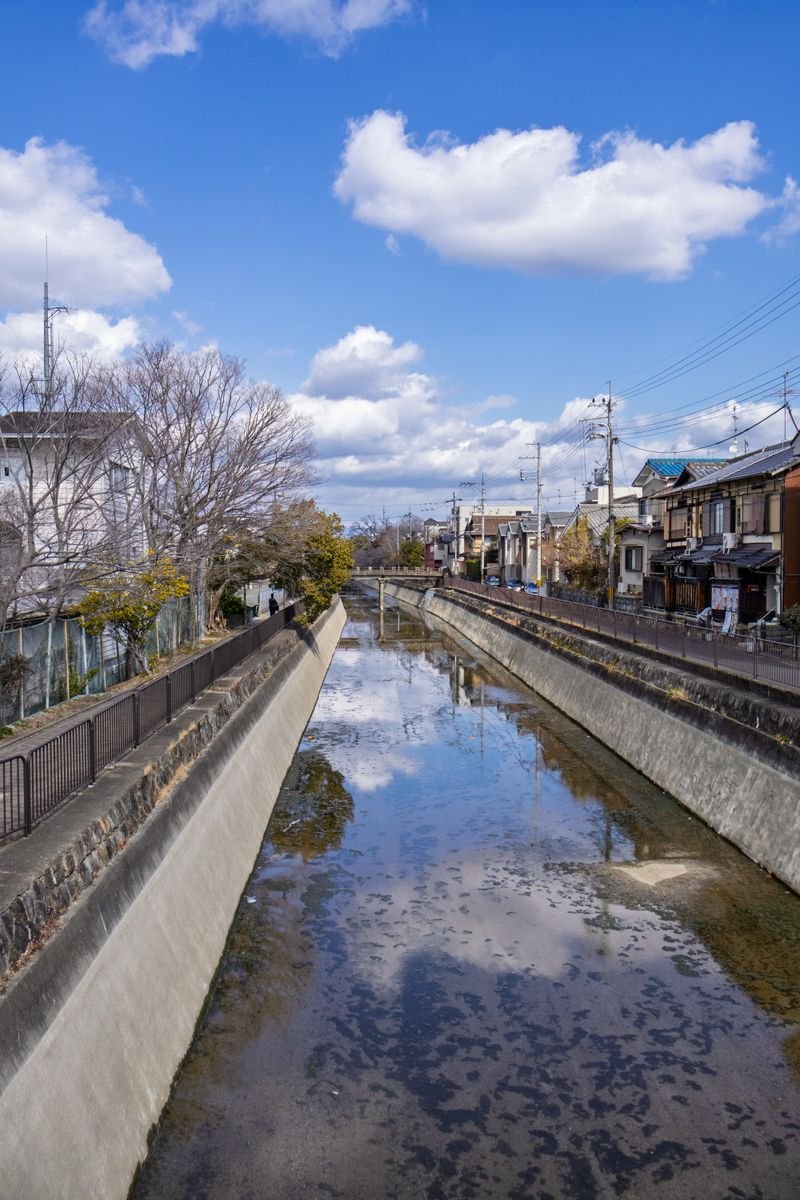 Kyoto canal with reflections near Horikawa river