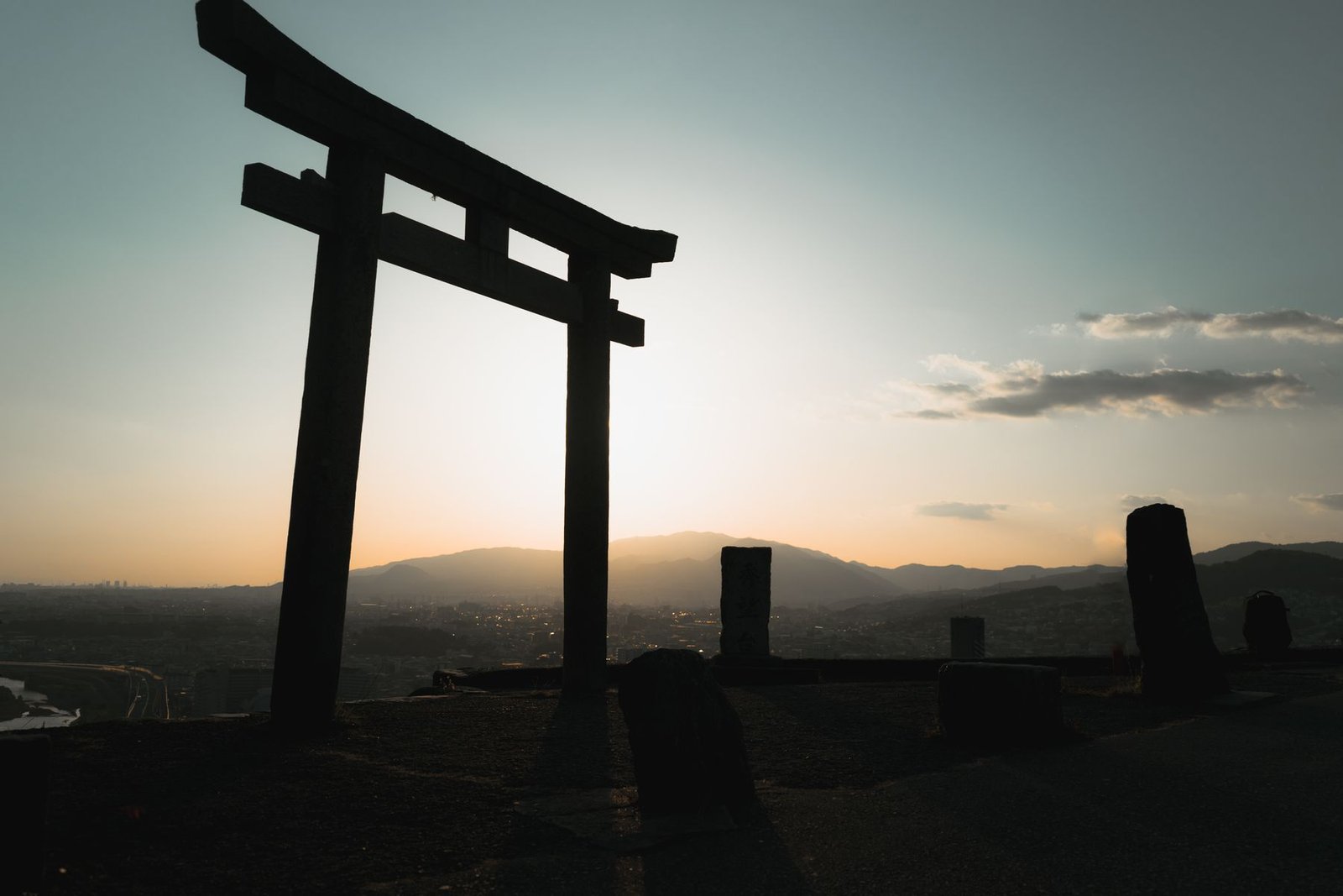Torii gate silhouette at sunset in Japan