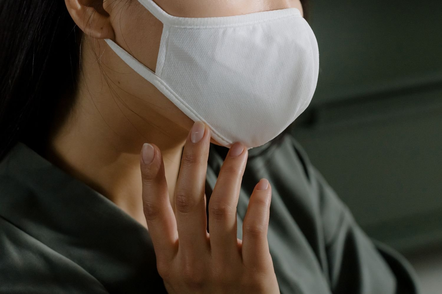 A person wearing a surgical mask on a street in Japan