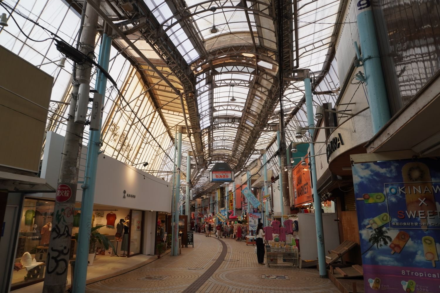 A covered shopping arcade street in Japan in the evening