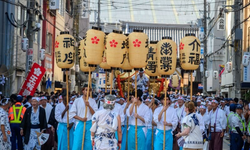 Traditional Japanese festival with lanterns and crowd