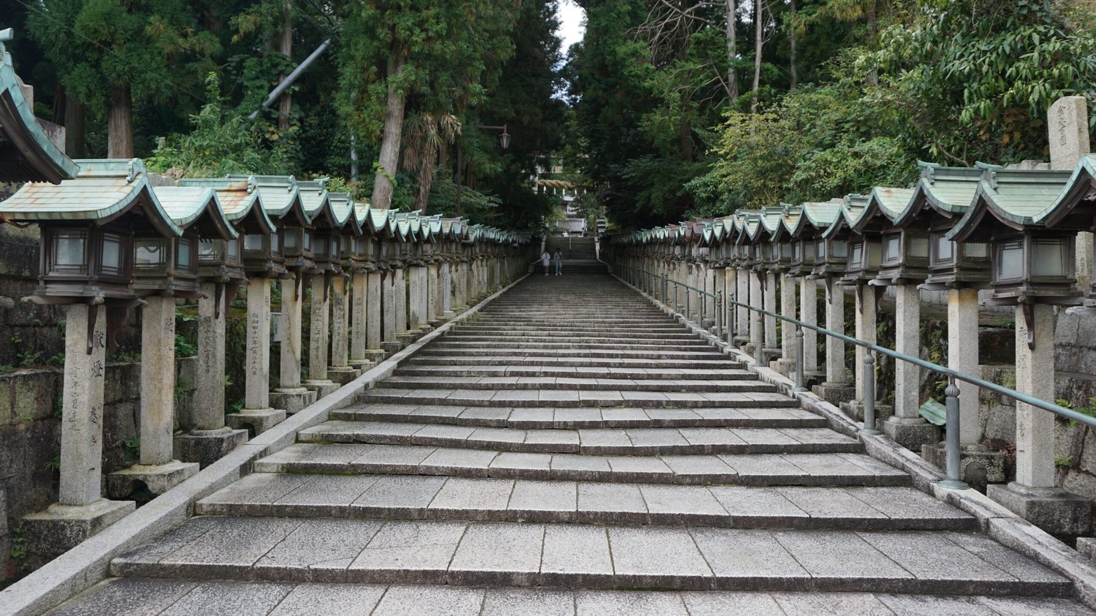 Stone shrine steps along a forest path in Japan