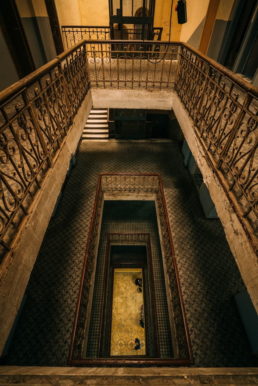 A staircase viewed from above, evoking the thirteen steps of Sugamo urban legend