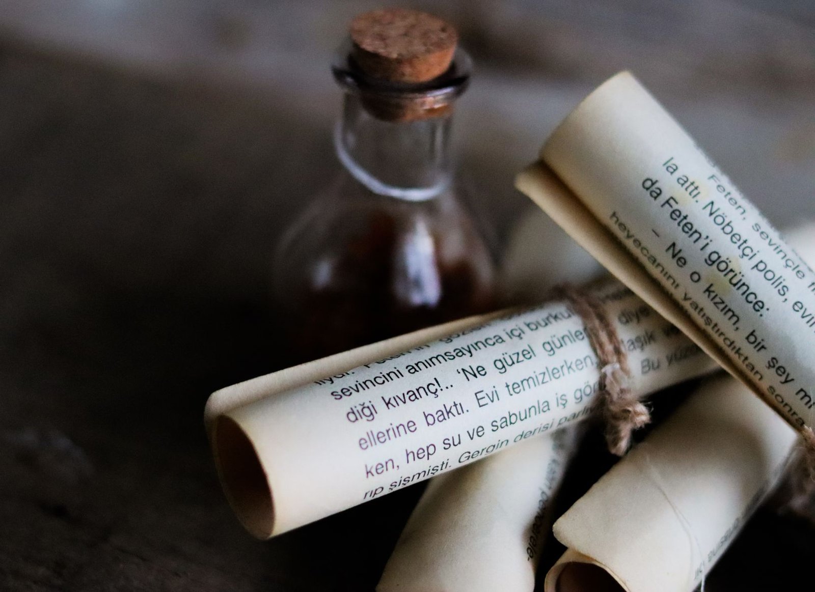 Rolled antique scrolls and papers evoking an old handwritten manuscript