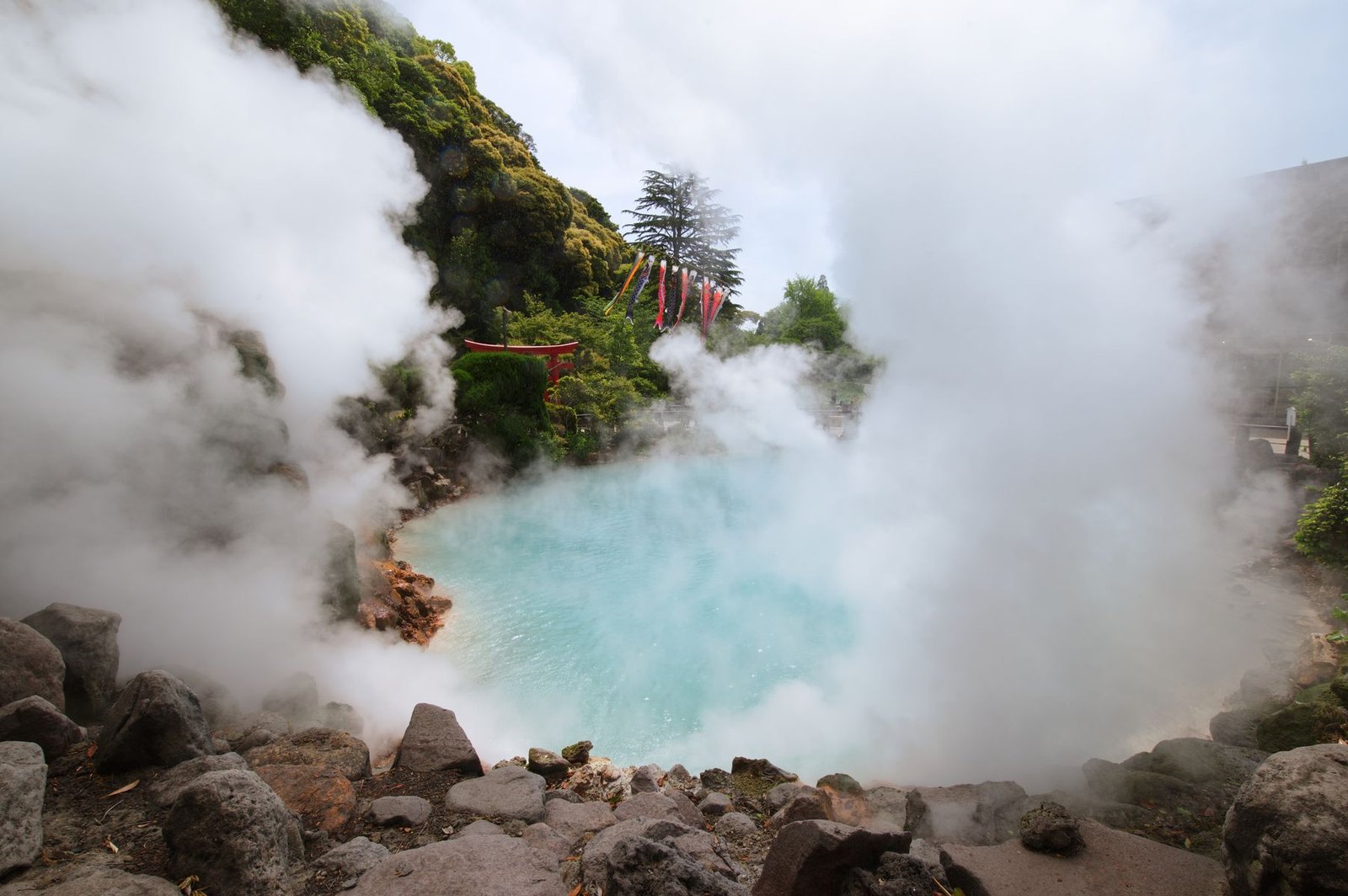 Steam rising from a traditional Japanese hot spring