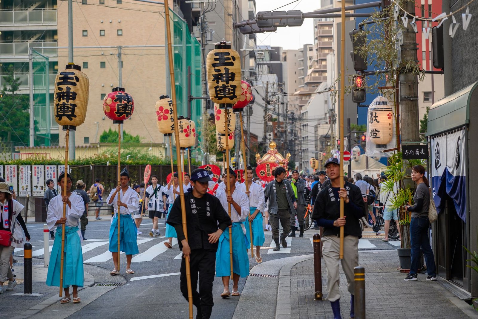 Traditional Japanese street festival parade with lanterns