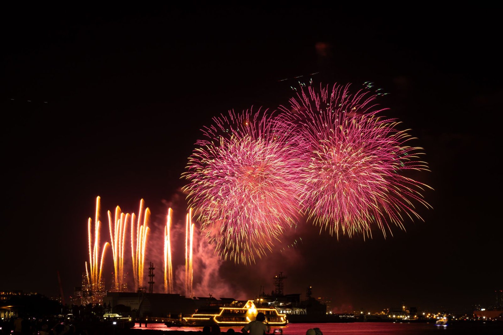 Fireworks lighting up the night sky over a festival in Japan