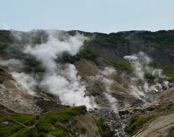 Steam rising from the sulphurous ground of the Jigokudani geothermal valley in Noboribetsu, Hokkaido