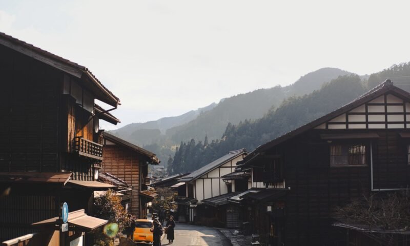 A traditional Japanese mountain village surrounded by hills