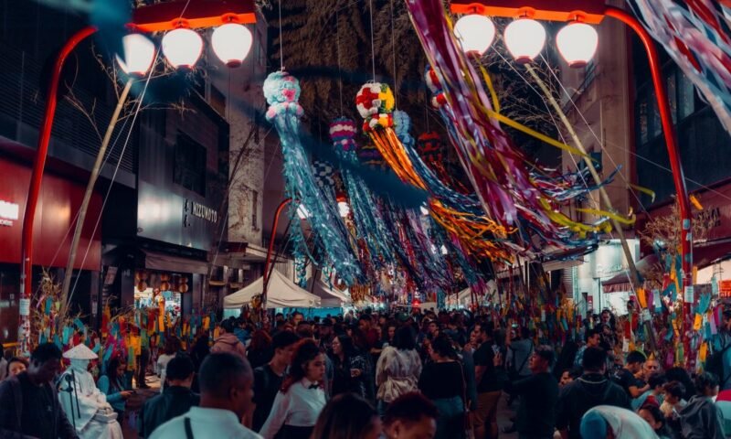 Vibrant night festival with colorful decorations and a bustling crowd