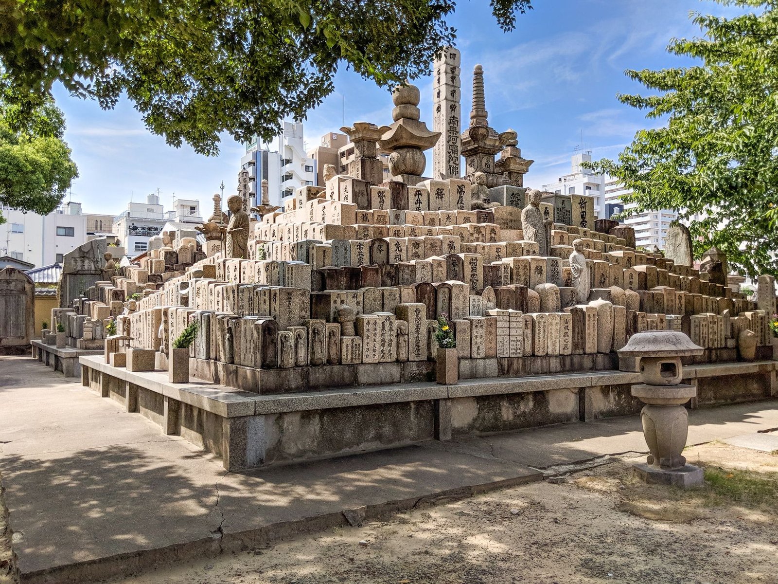 Historic stone gravestones in a quiet Japanese temple grounds