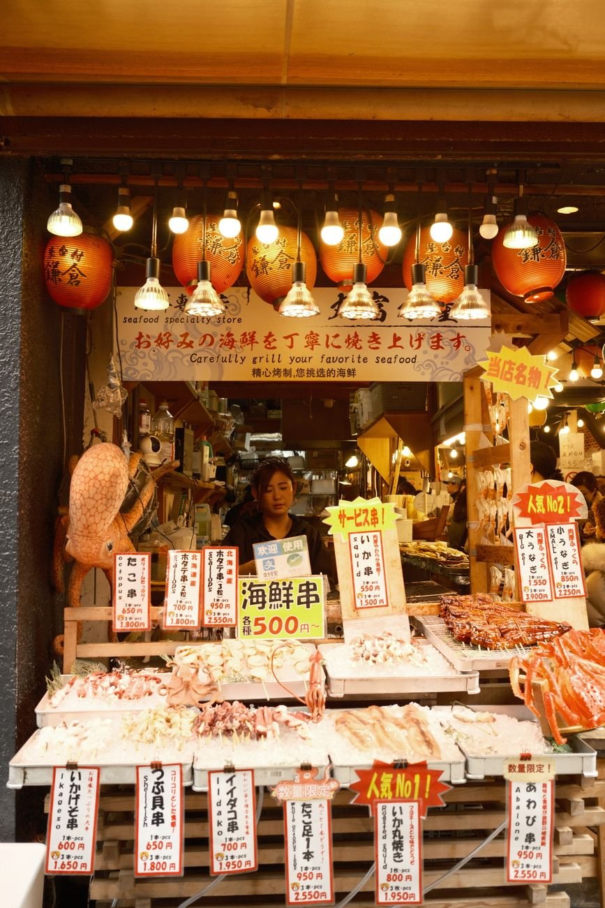 Fresh seafood on display at a Japanese market stall