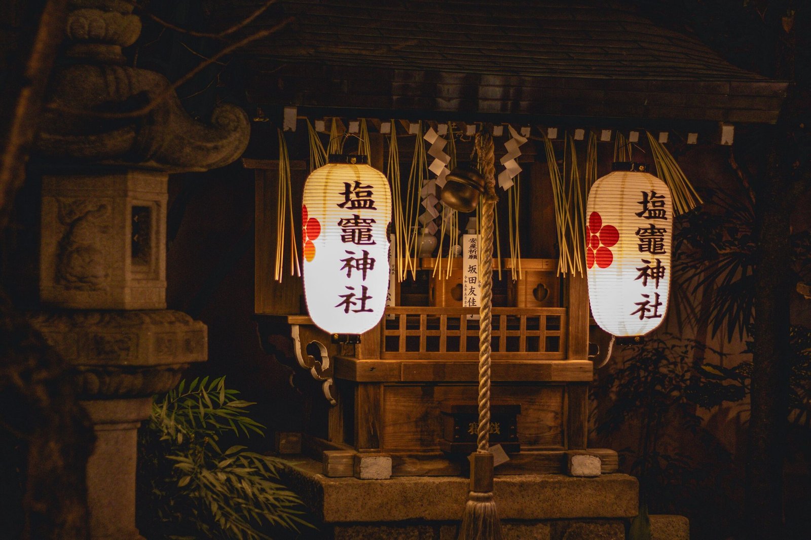 Illuminated lanterns at a Japanese shrine at night