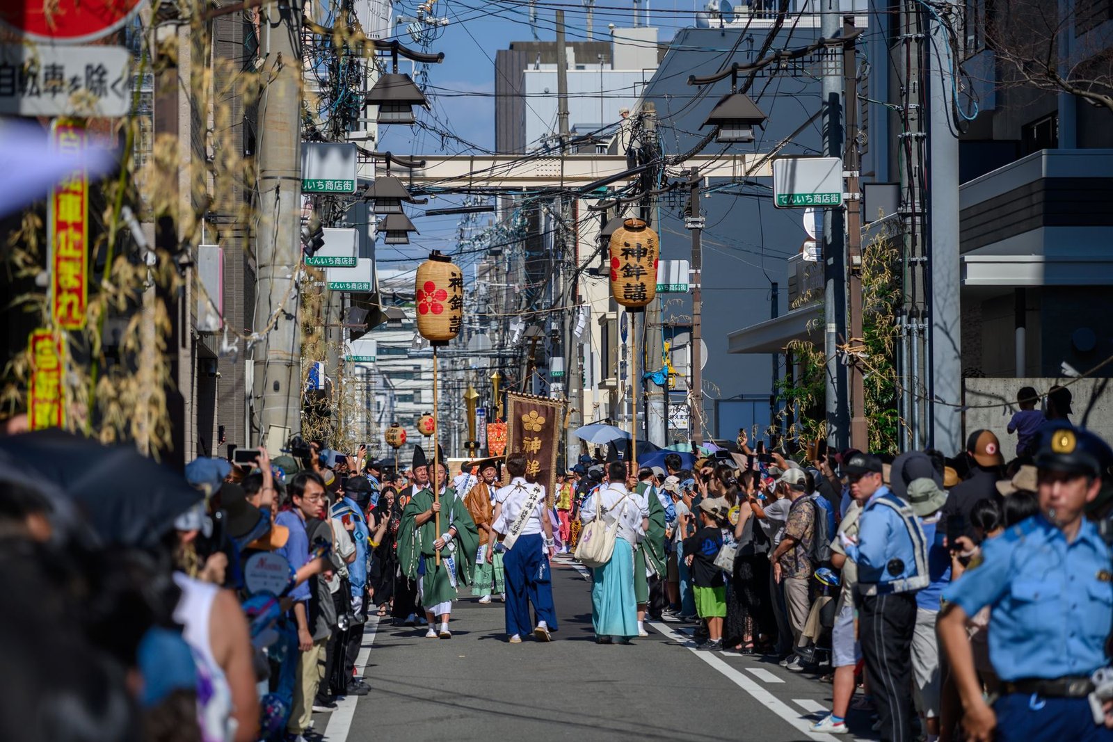 Performers in traditional costume at a Japanese street festival parade