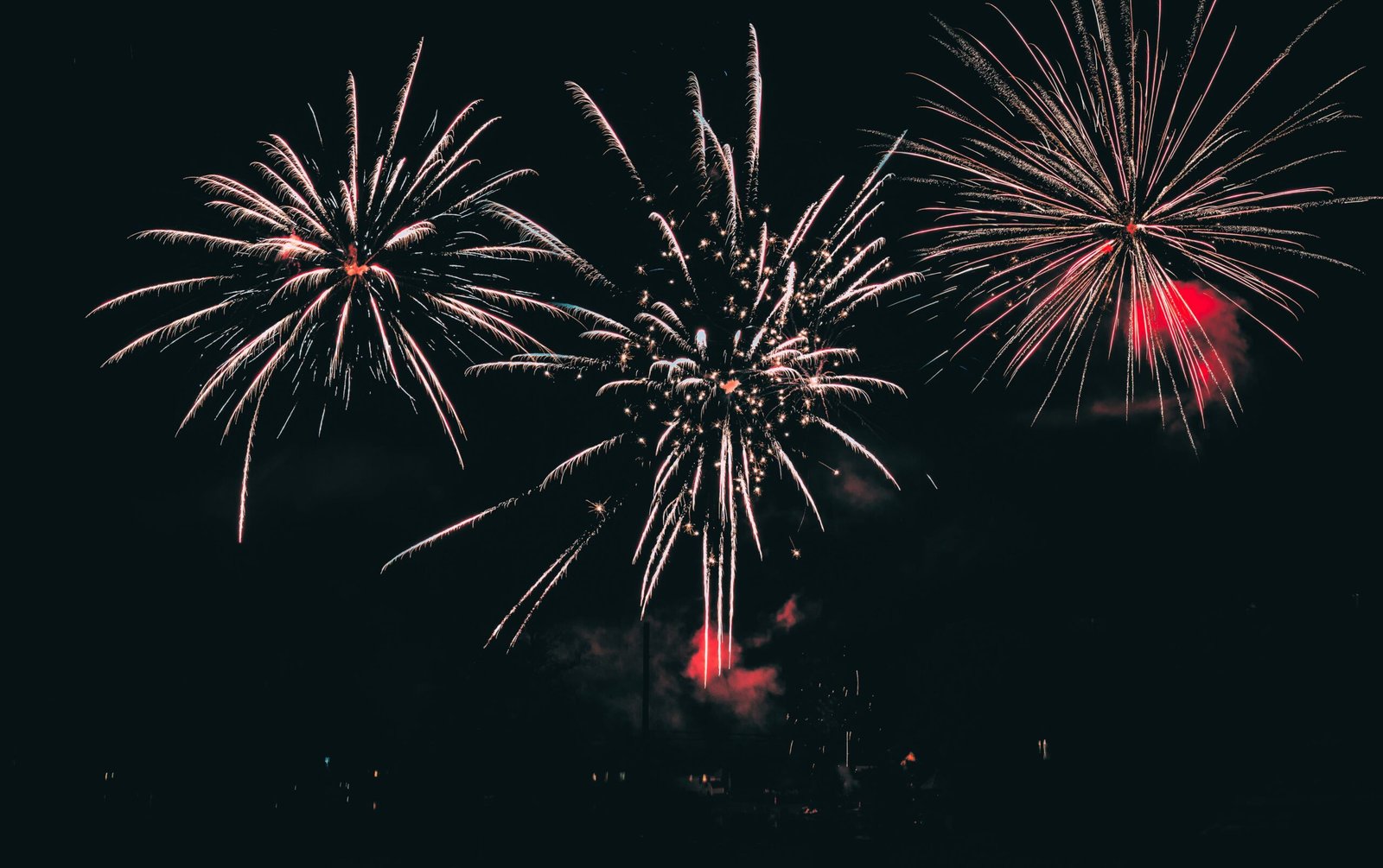 Large colorful fireworks display bursting over a dark night sky