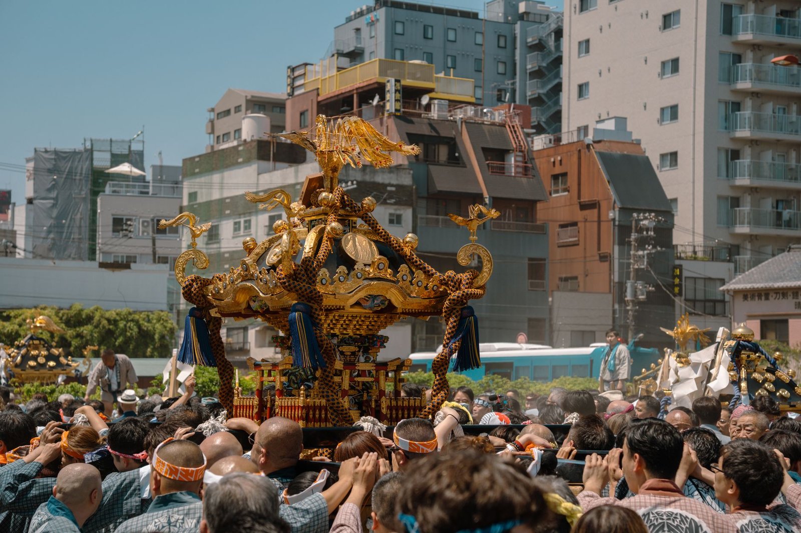 Traditional Japanese festival parade with a mikoshi shrine