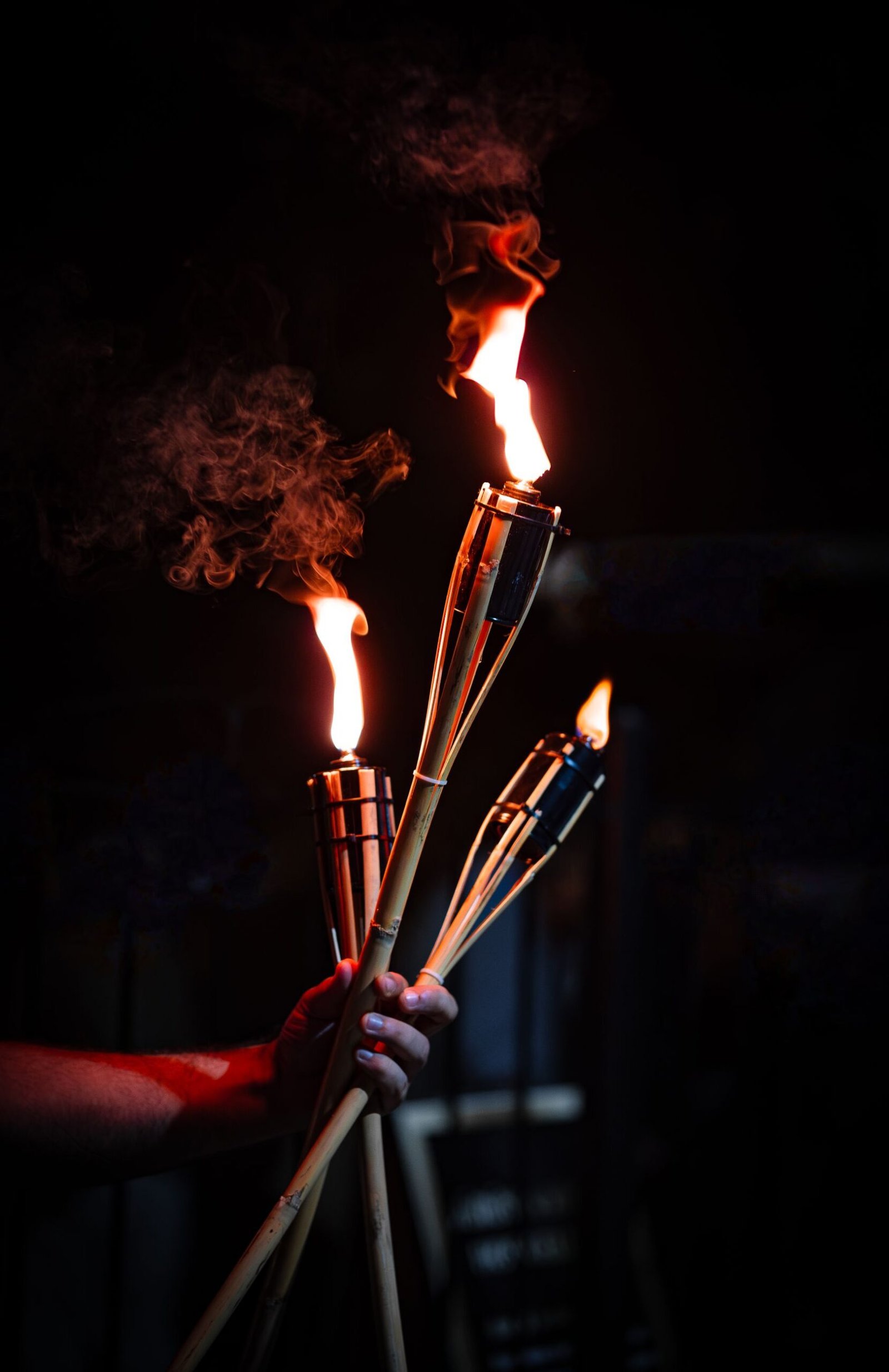 Giant wooden torch burning at night during a Japanese fire festival