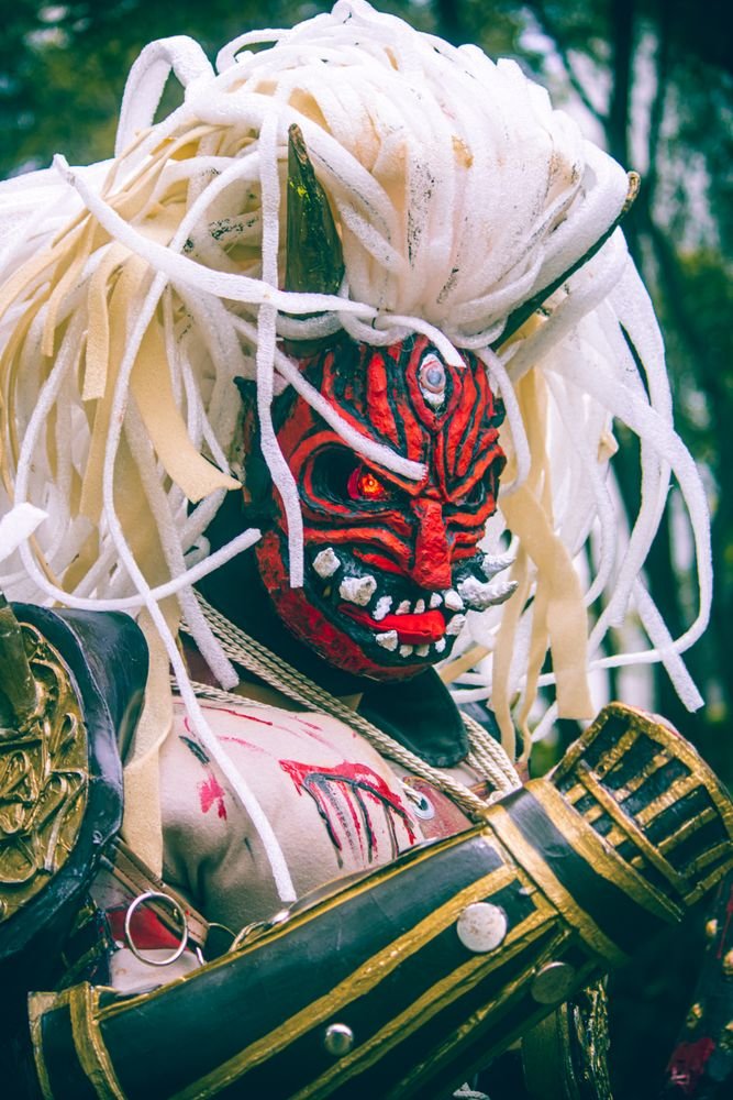 Demon-mask festival costume evoking Japan's yokai folklore