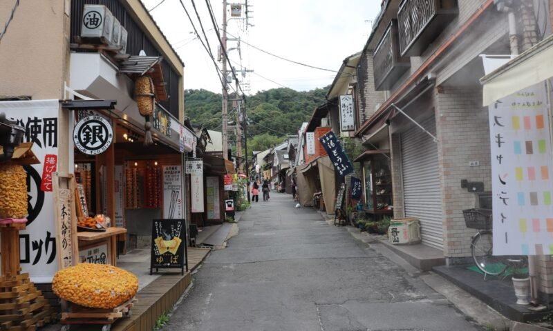 A yokai figure watches over a shopfront on Kyoto's Yokai Street