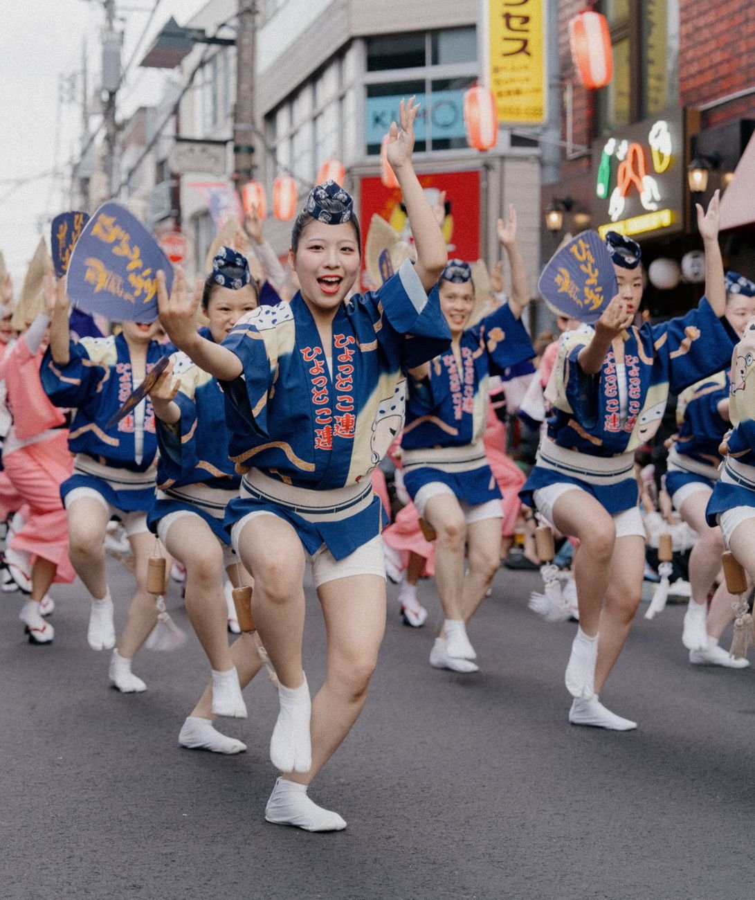 Dancers performing a traditional Japanese festival dance in colorful costumes